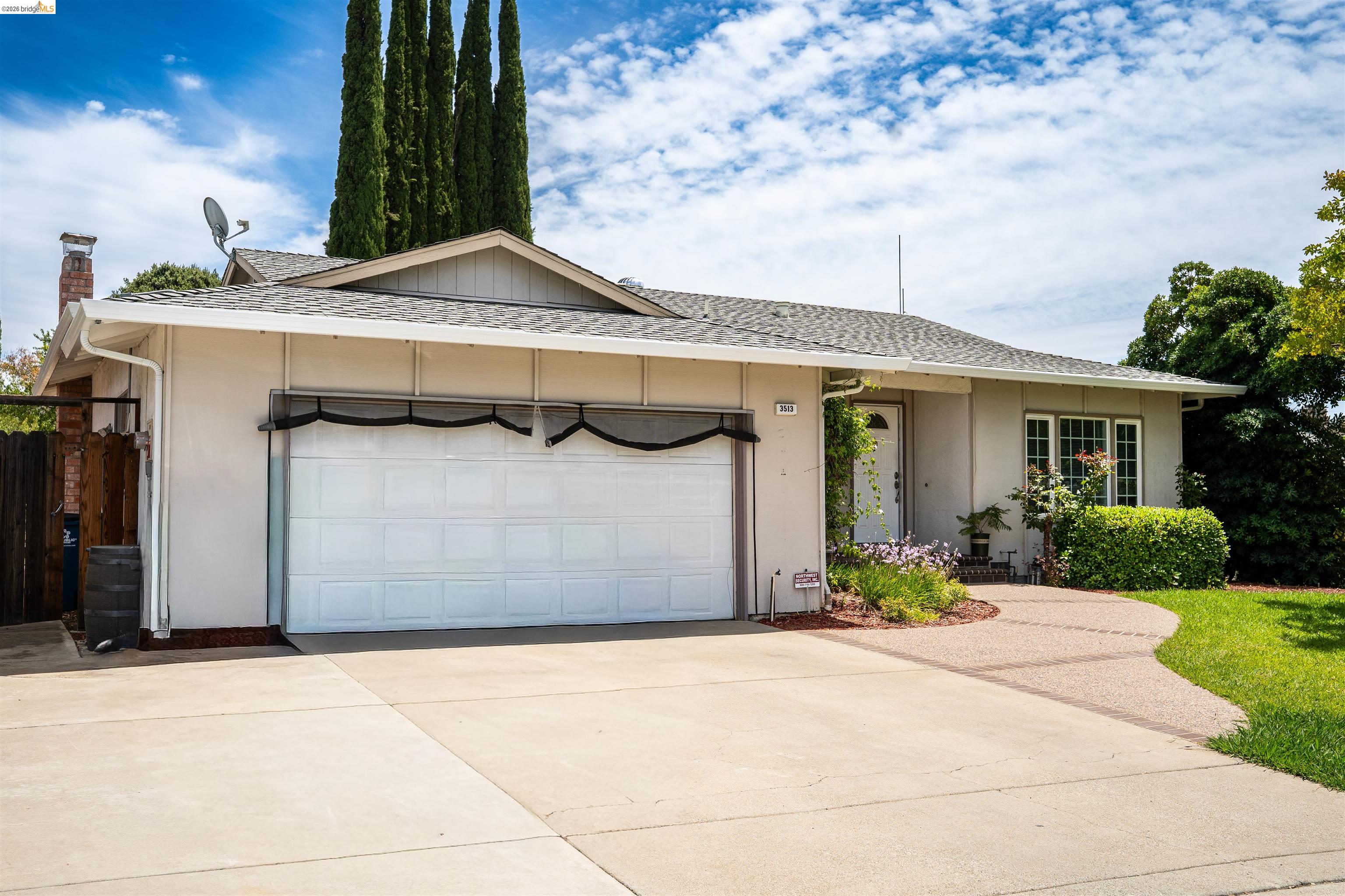 3513 Rio Grande Drive Antioch, CA 94509 - Photo 1 of 22 Single-story residence featuring an attached two-car garage, concrete driveway, and a decorative walkway leading to the front entry