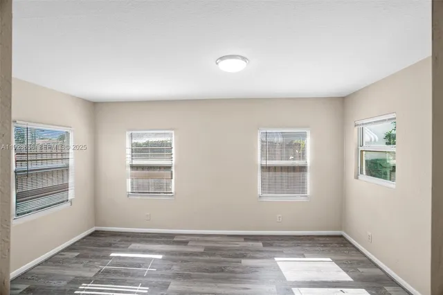 a view of an empty room with a window