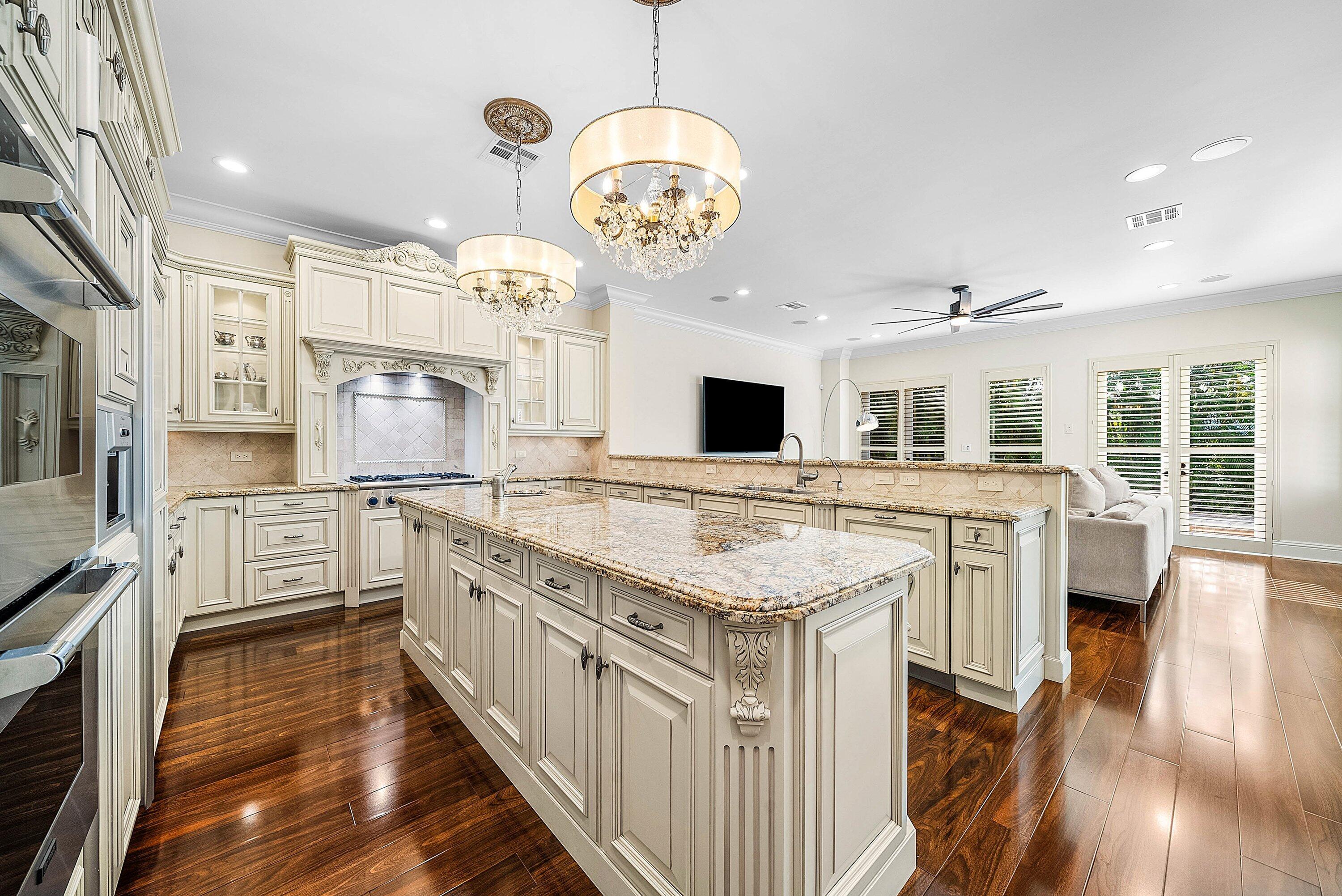 398 Northeast 7th Street Boca Raton, FL 33432 - Photo 29 of 74 a kitchen with stainless steel appliances granite countertop a stove oven and a refrigerator