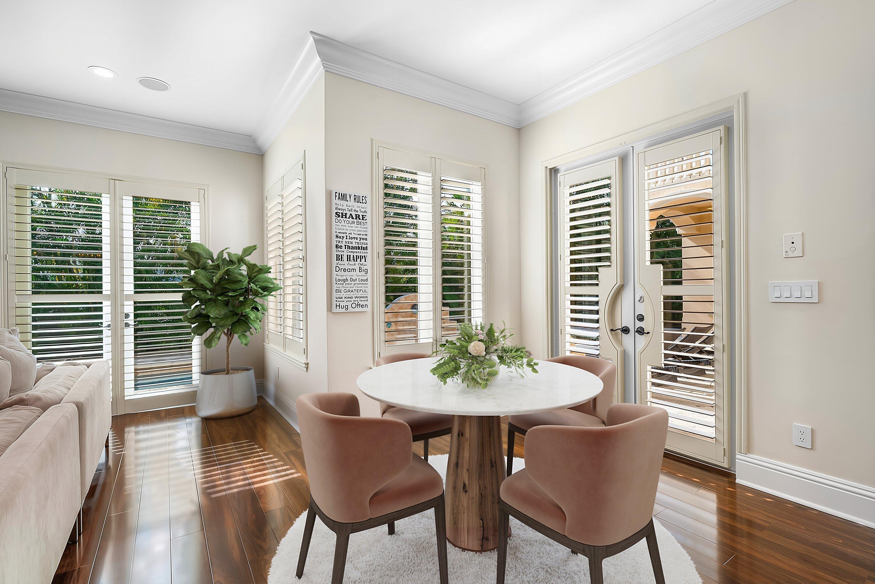 398 Northeast 7th Street Boca Raton, FL 33432 - Photo 33 of 74 a view of a dining room with furniture window and wooden floor