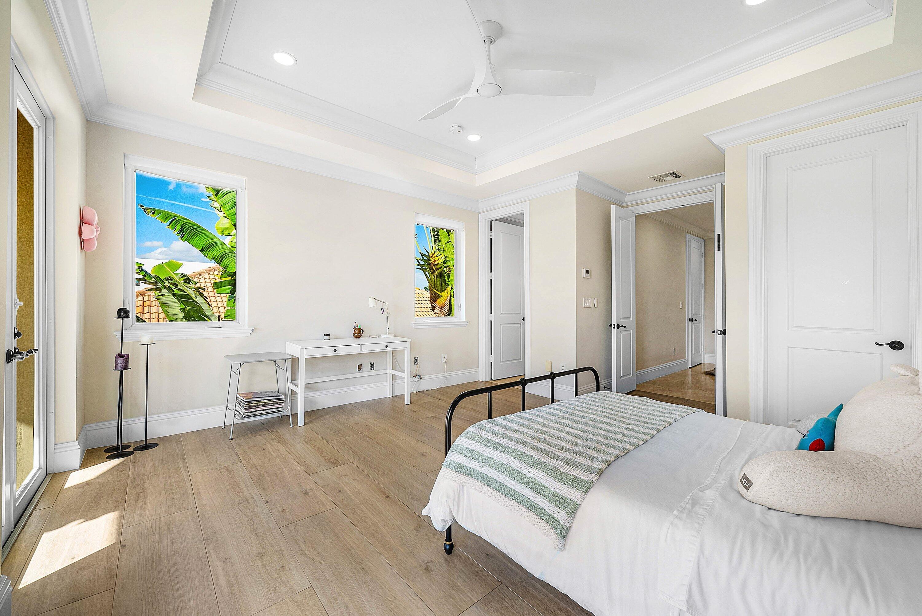 398 Northeast 7th Street Boca Raton, FL 33432 - Photo 44 of 74 a bedroom with a bed and a table