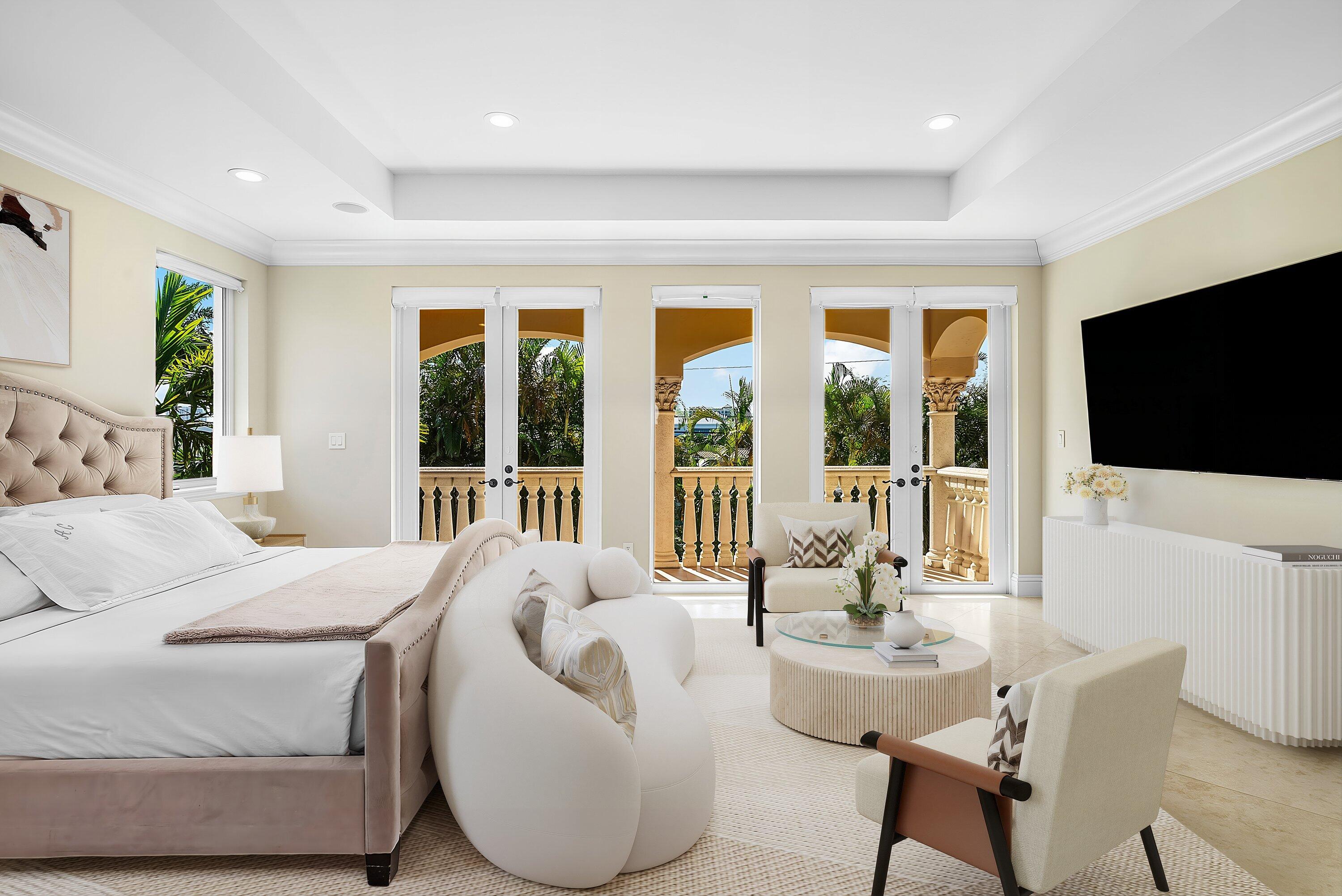 398 Northeast 7th Street Boca Raton, FL 33432 - Photo 53 of 74 a bedroom with a large bed and a flat screen tv