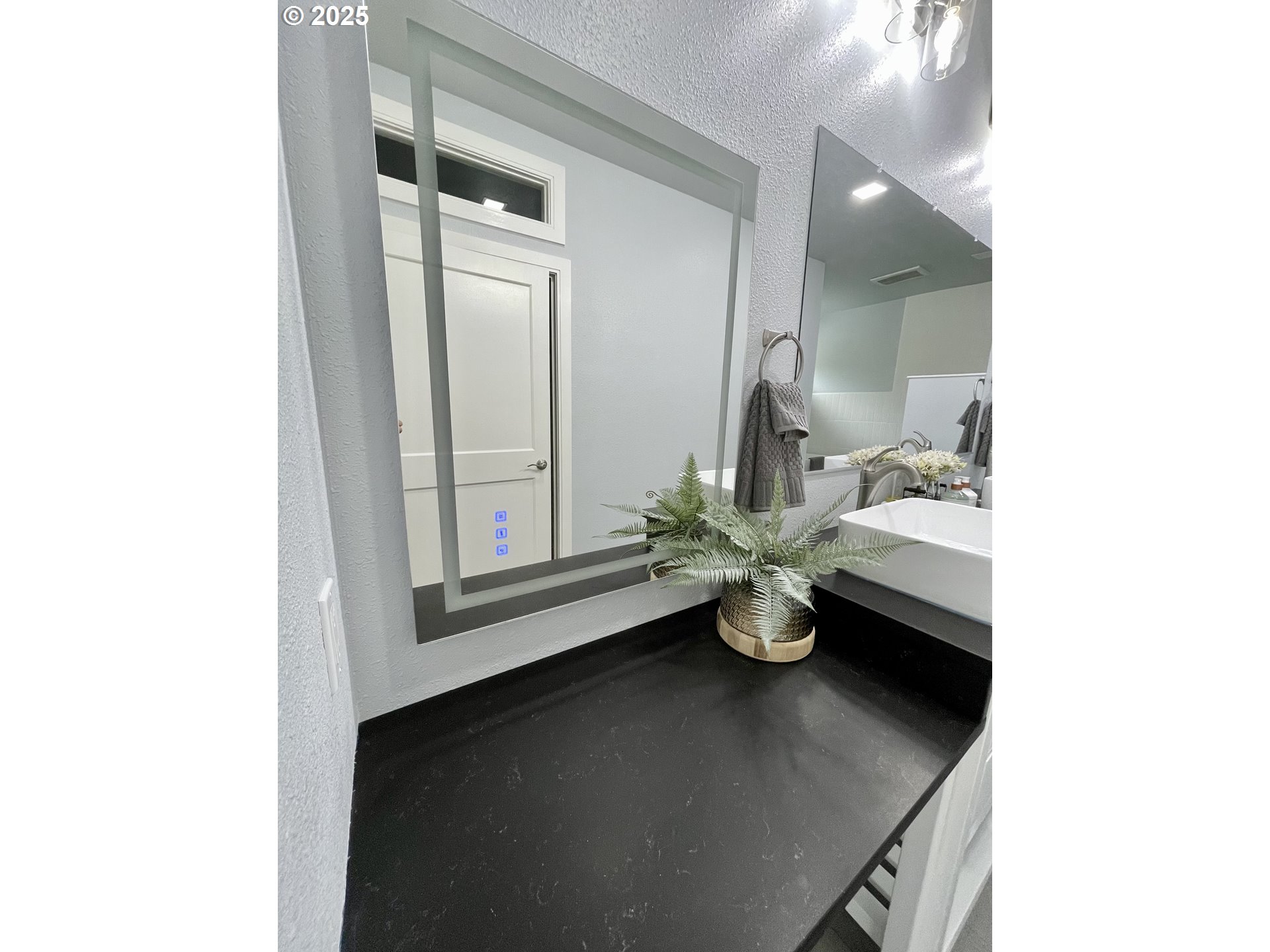905 Bellevue Drive Reedsport, OR 97467 - Photo 20 of 37 a room with a sink and a potted plant on table