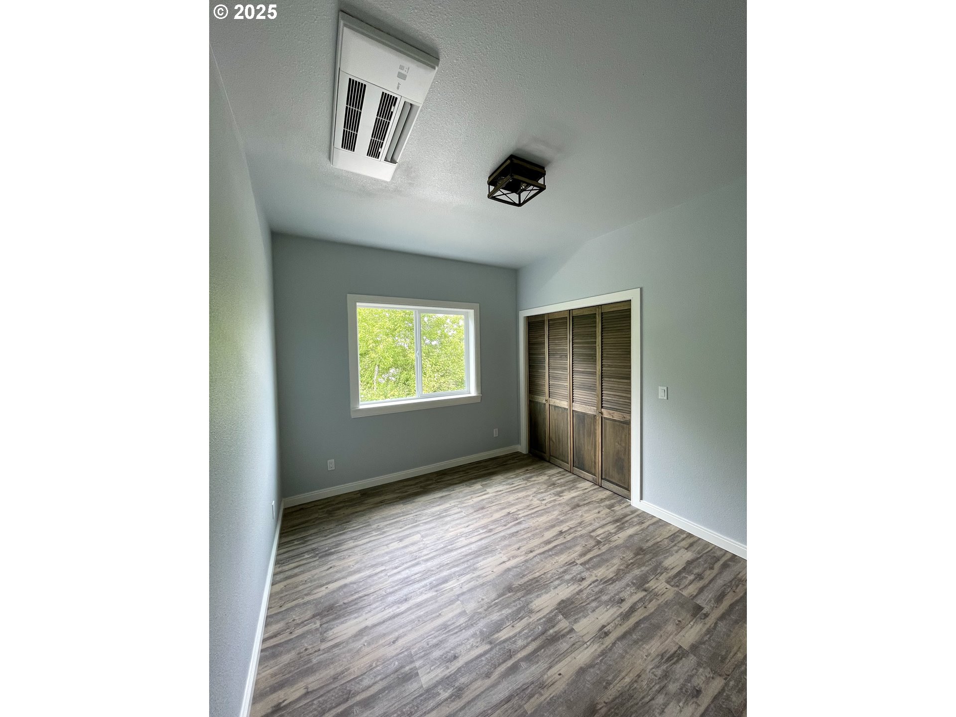 905 Bellevue Drive Reedsport, OR 97467 - Photo 23 of 37 a view of an empty room with a window