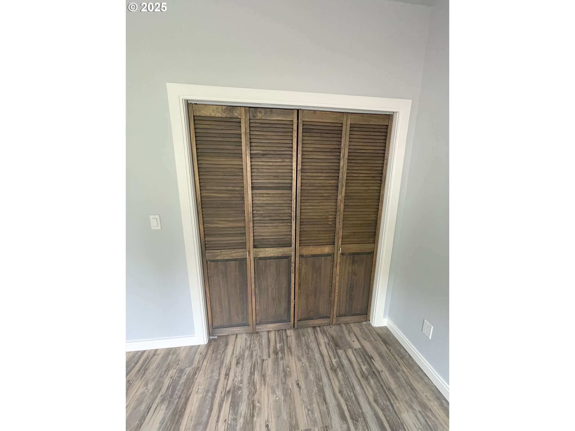 905 Bellevue Drive Reedsport, OR 97467 - Photo 29 of 37 a view of an empty room with wooden floor
