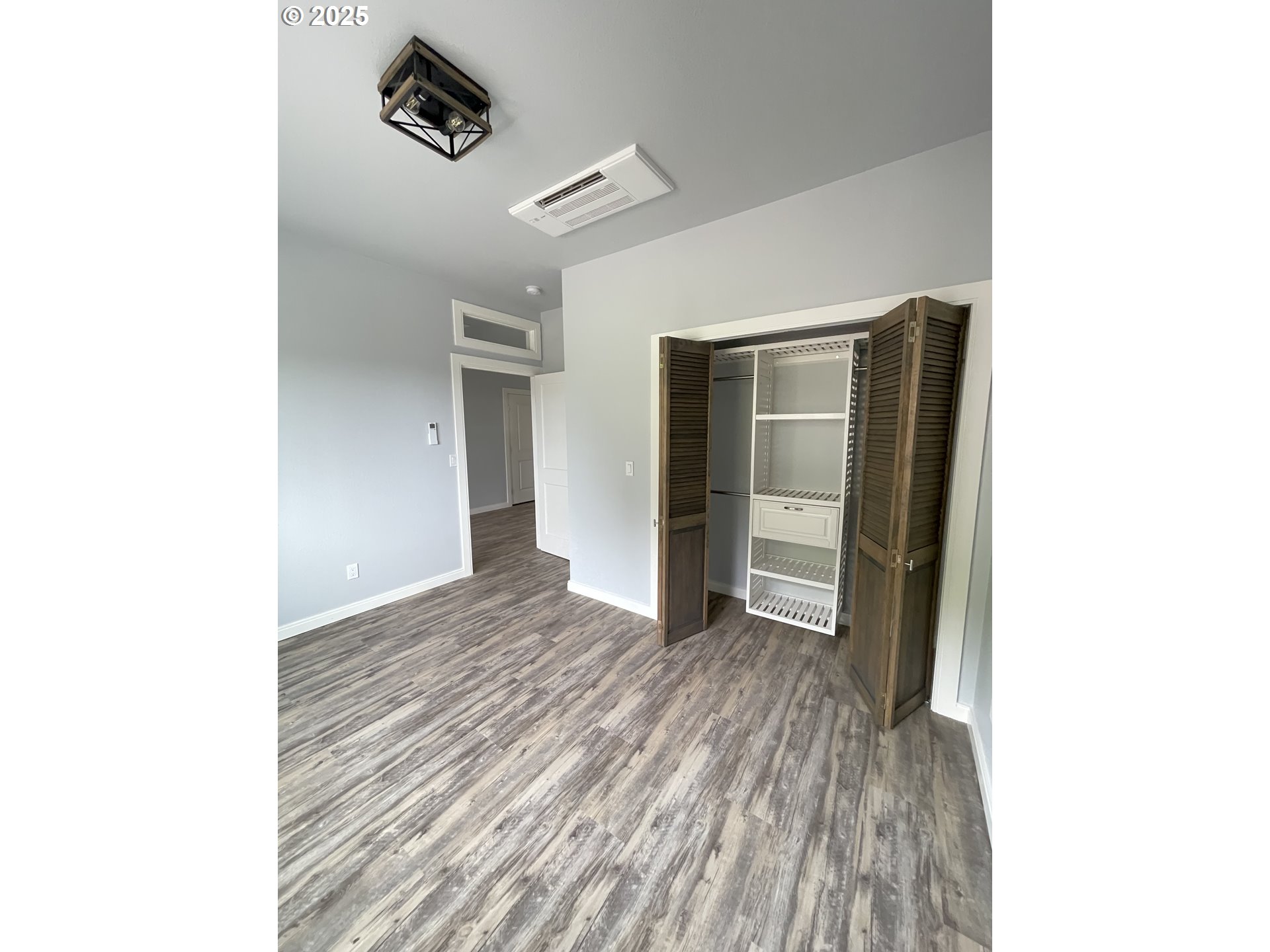 905 Bellevue Drive Reedsport, OR 97467 - Photo 30 of 37 a view of an empty room with wooden floor