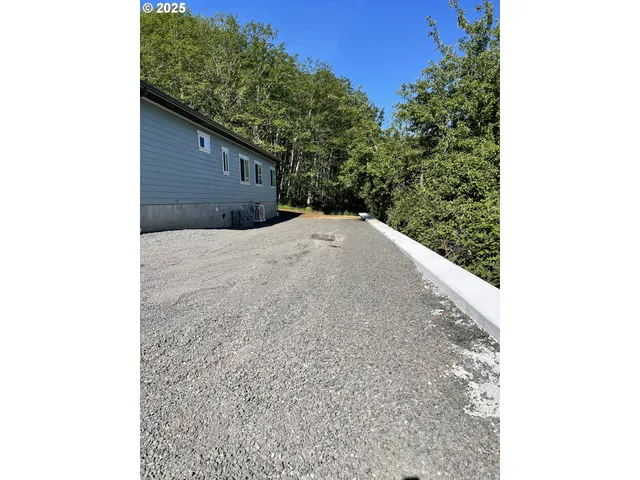 a picture of a tree in front of a house