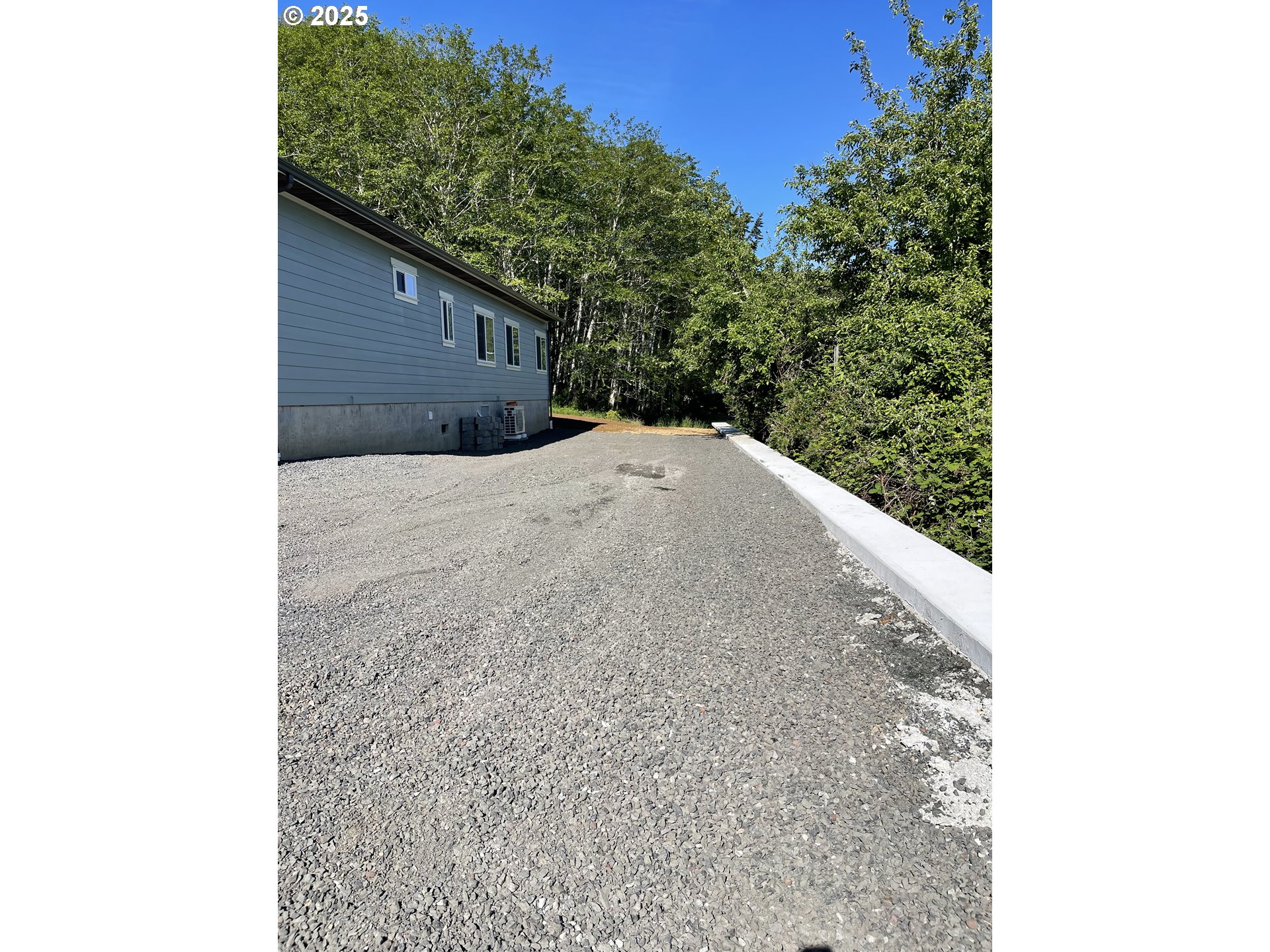 905 Bellevue Drive Reedsport, OR 97467 - Photo 35 of 37 a picture of a tree in front of a house