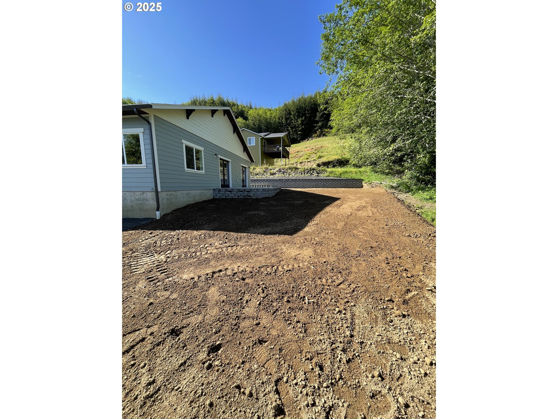 905 Bellevue Drive Reedsport, OR 97467 - Photo 36 of 37 a view of a house with a yard