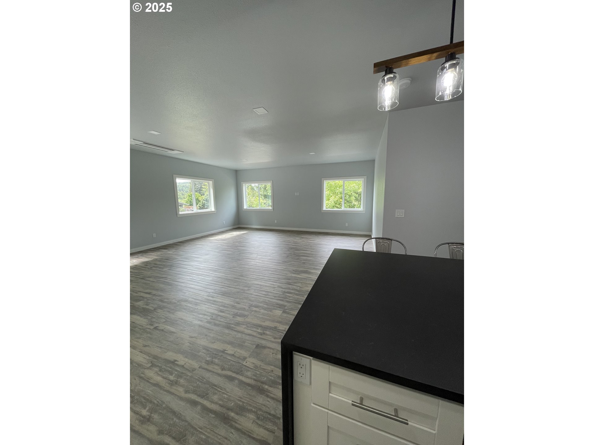 905 Bellevue Drive Reedsport, OR 97467 - Photo 5 of 37 a view of an empty room and window