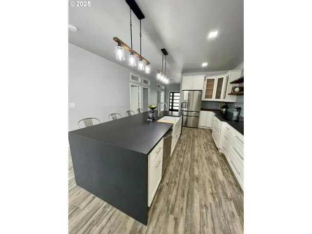 a view of a living room with a sink and dishwasher