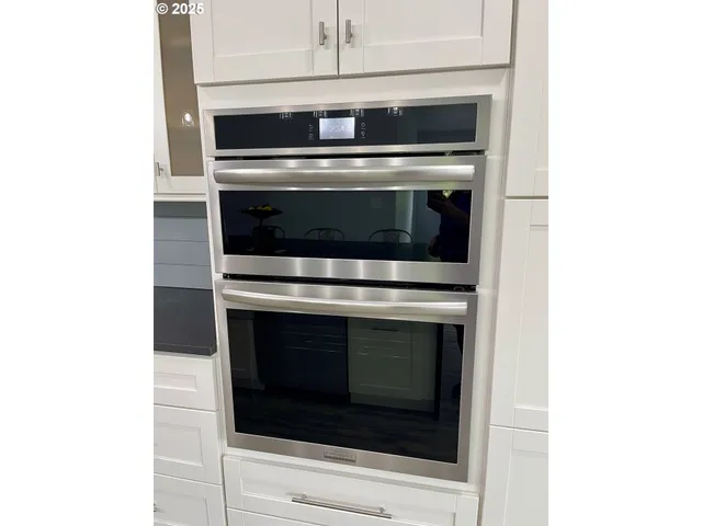 a stove top oven sitting inside of a microwave