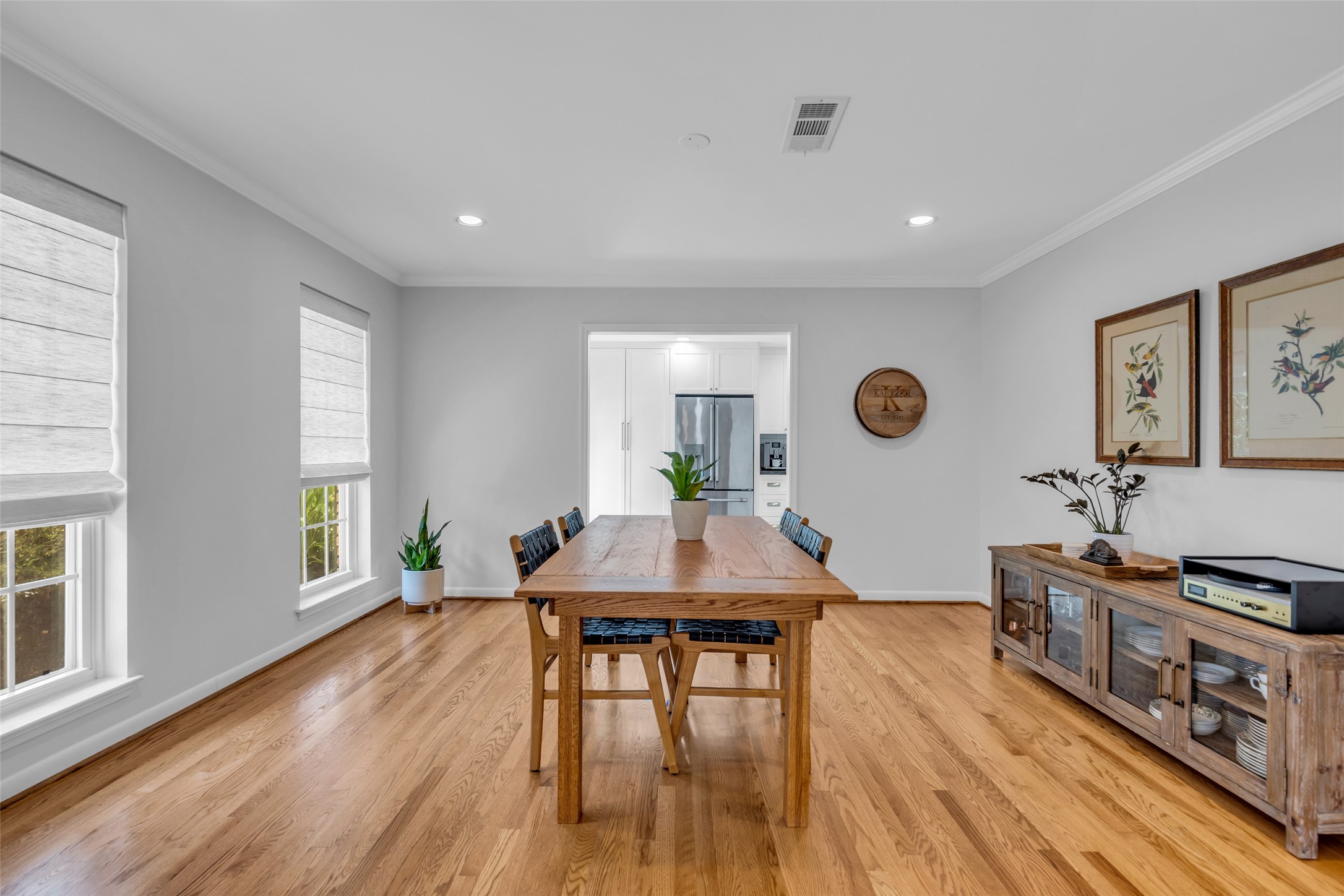 2526 Teague Road Houston, TX 77080 - Photo 7 of 41 Bright and inviting dining area featuring warm hardwood floors, perfect for both casual meals and formal entertaining.