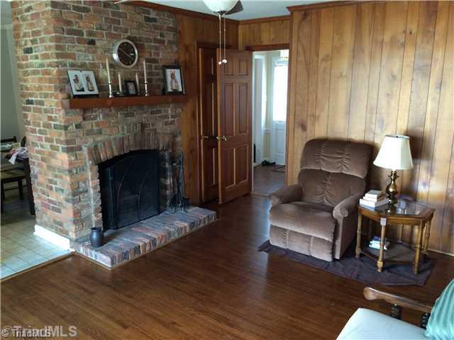 3261 Polo Road Winston-Salem, NC 27106 - Photo 2 of 16 Den/Family/Great Room. wood floors and wood burning fireplace.