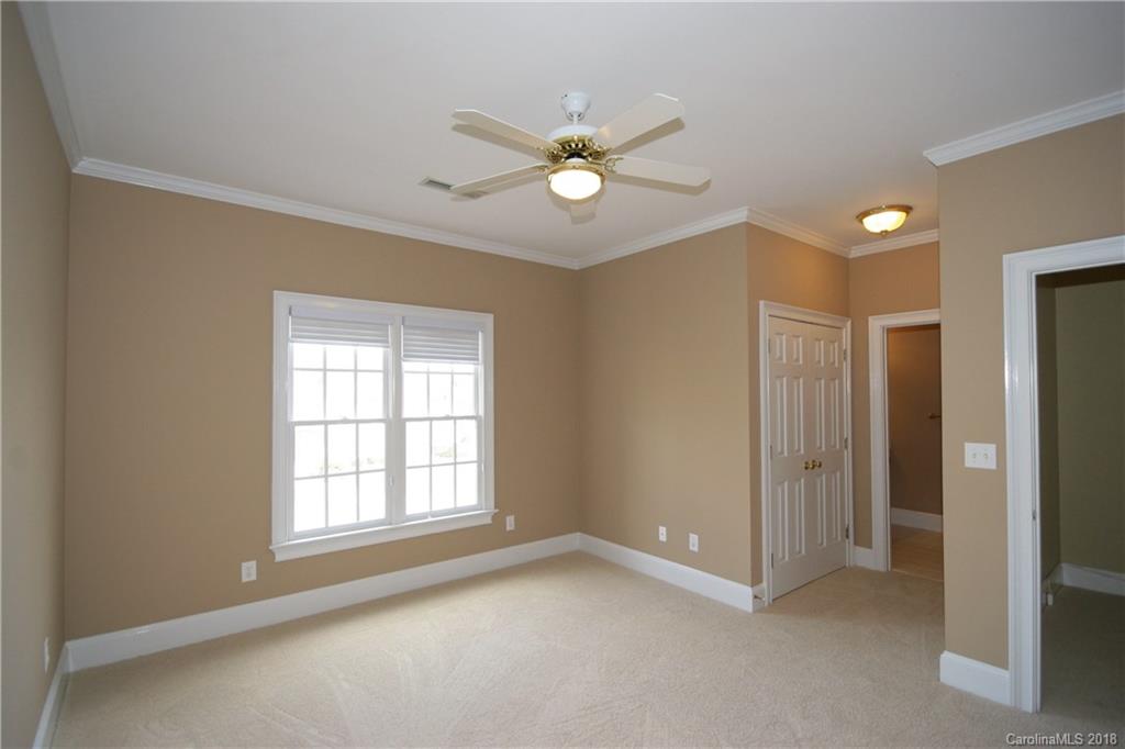 18628 Square Sail Road Cornelius, NC 28031 - Photo 13 of 19 a view of an empty room with a window