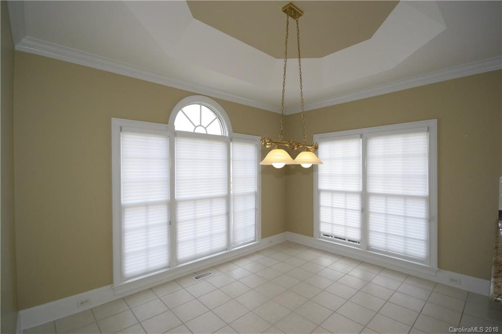 18628 Square Sail Road Cornelius, NC 28031 - Photo 16 of 19 a view of an empty room with a window