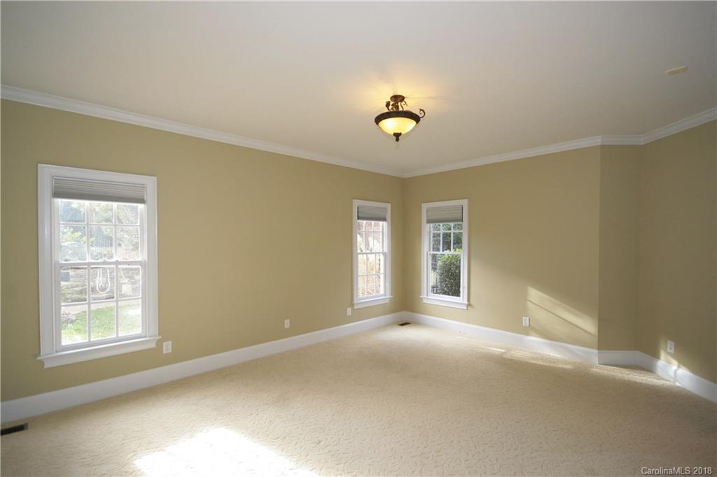 18628 Square Sail Road Cornelius, NC 28031 - Photo 17 of 19 a view of an empty room with a window