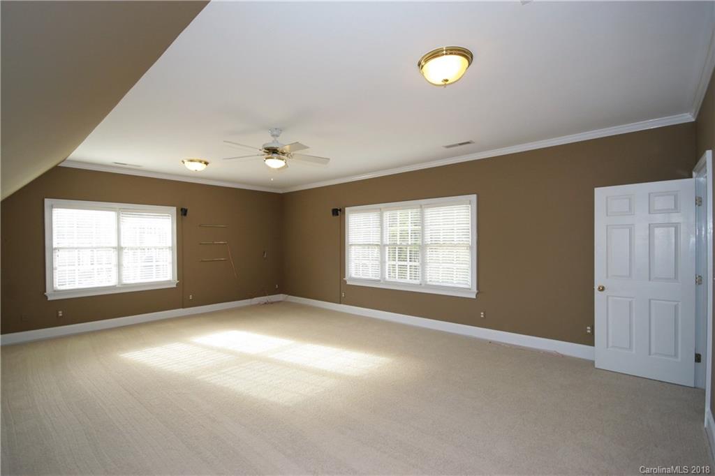 18628 Square Sail Road Cornelius, NC 28031 - Photo 18 of 19 a view of an empty room with a window