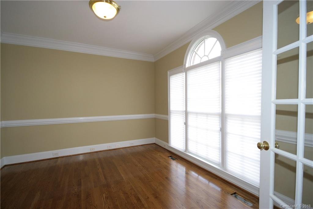 18628 Square Sail Road Cornelius, NC 28031 - Photo 19 of 19 a view of empty room with wooden floor and fan