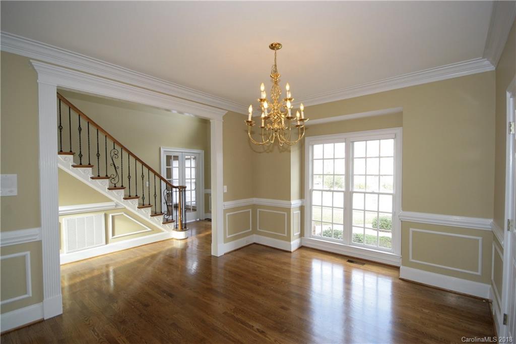 18628 Square Sail Road Cornelius, NC 28031 - Photo 3 of 19 a view of an entryway with wooden floor and staircase