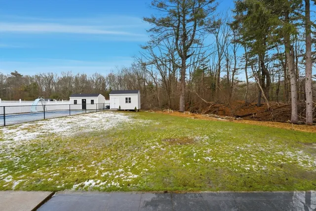 a view of a yard with an outdoor seating