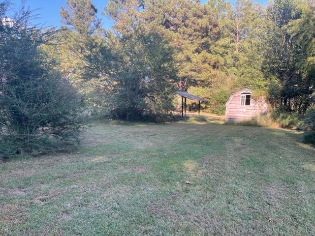 9945 Tracy Road Atoka, TN 38004 - Photo 13 of 19 a view of a field with a tree in the background