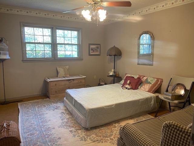 9945 Tracy Road Atoka, TN 38004 - Photo 3 of 19 a bedroom with a bed and a chandelier