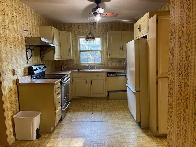 9945 Tracy Road Atoka, TN 38004 - Photo 5 of 19 a kitchen with a sink stainless steel appliances a counter space and a window