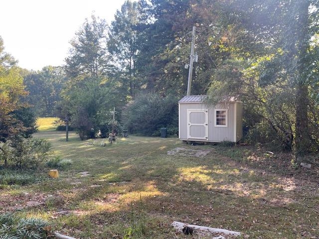 9945 Tracy Road Atoka, TN 38004 - Photo 6 of 19 a backyard of a house with table and chairs