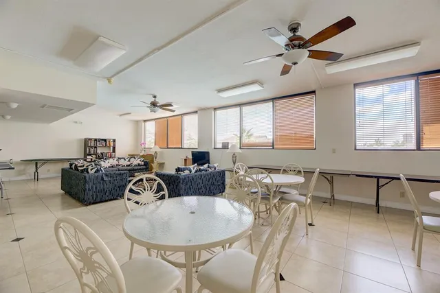 a very nice looking dining room with furniture