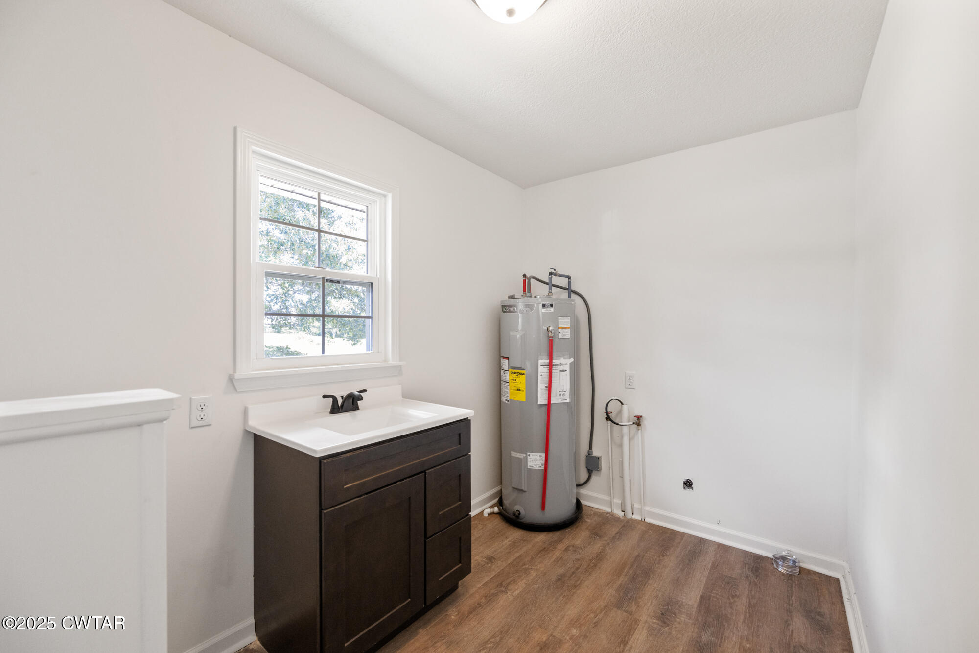 7371 Brooksie Thompson Road Bath Springs, TN 38311 - Photo 17 of 25 a room with a sink and a window