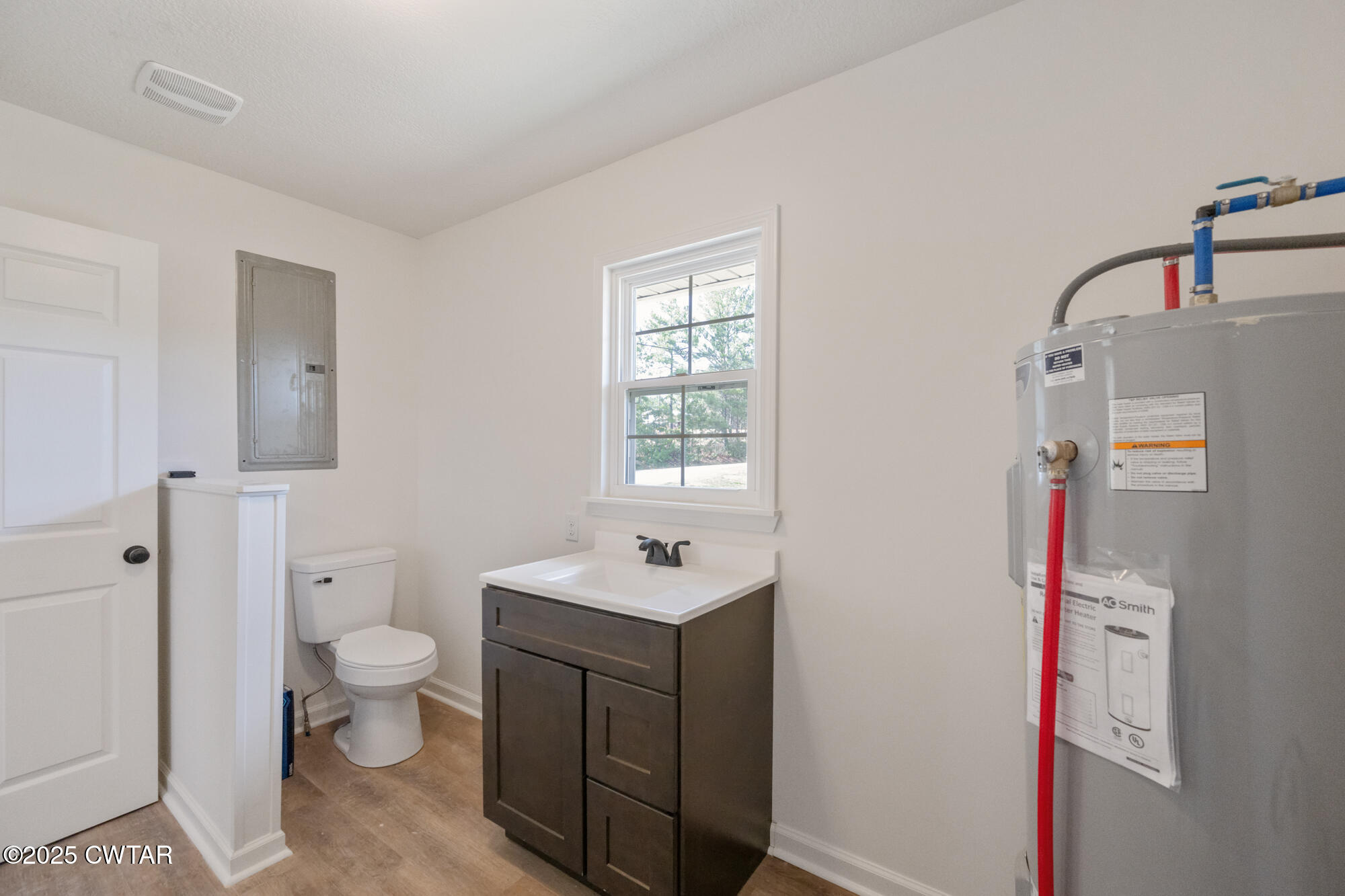 7371 Brooksie Thompson Road Bath Springs, TN 38311 - Photo 18 of 25 a bathroom with a sink a toilet and shower