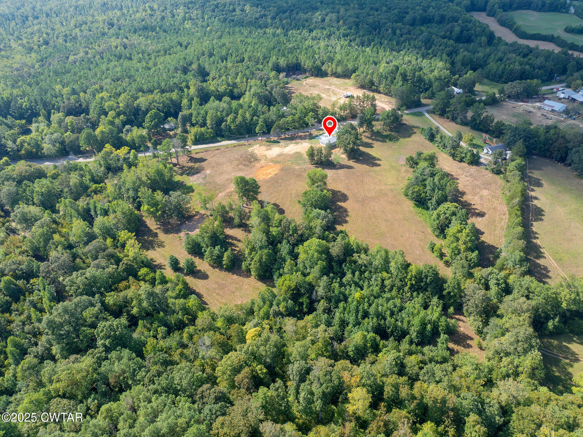 7371 Brooksie Thompson Road Bath Springs, TN 38311 - Photo 21 of 25 an aerial view of a house with a yard and lake view