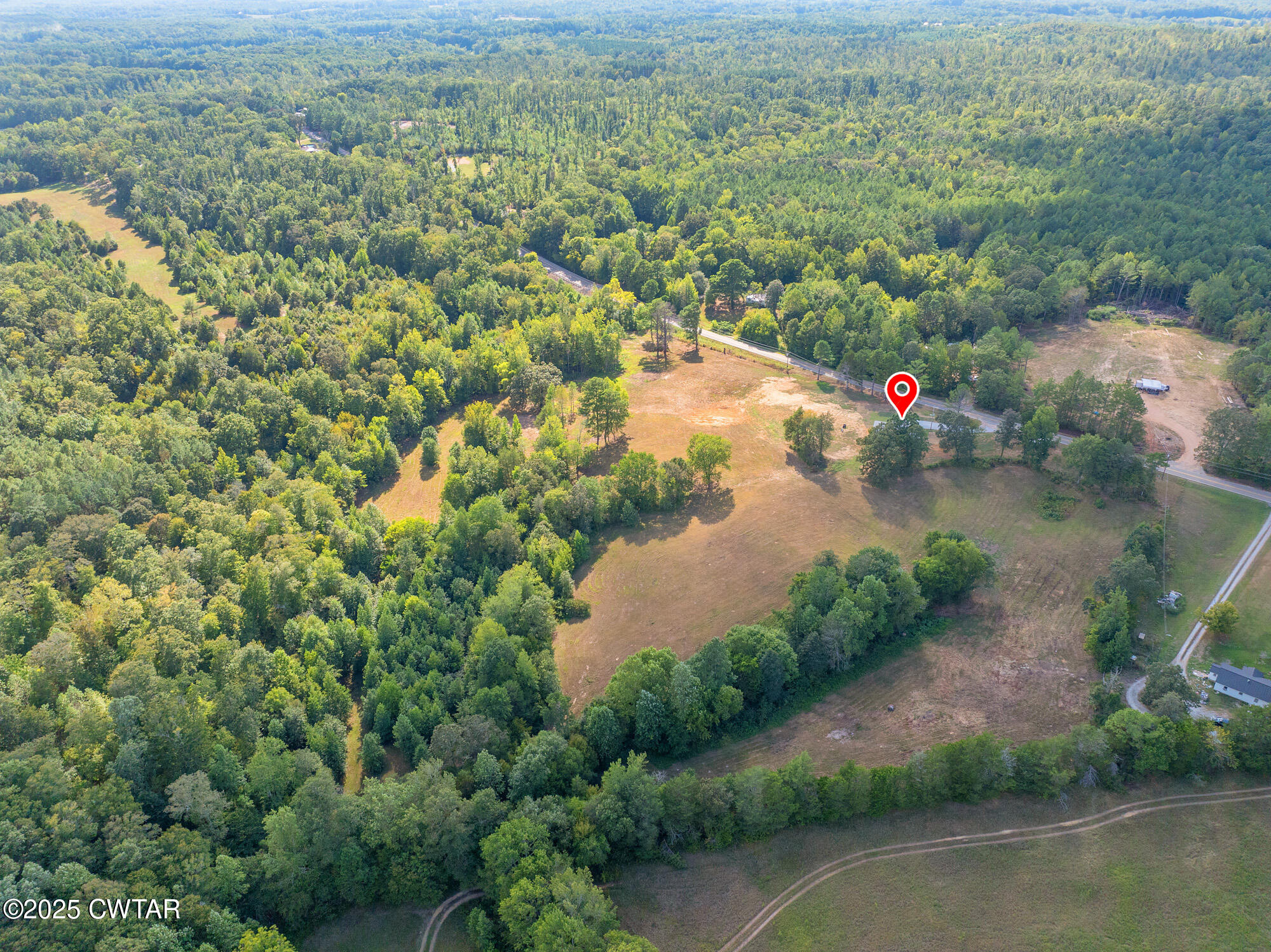 7371 Brooksie Thompson Road Bath Springs, TN 38311 - Photo 22 of 25 an aerial view of residential houses with outdoor space and lake view