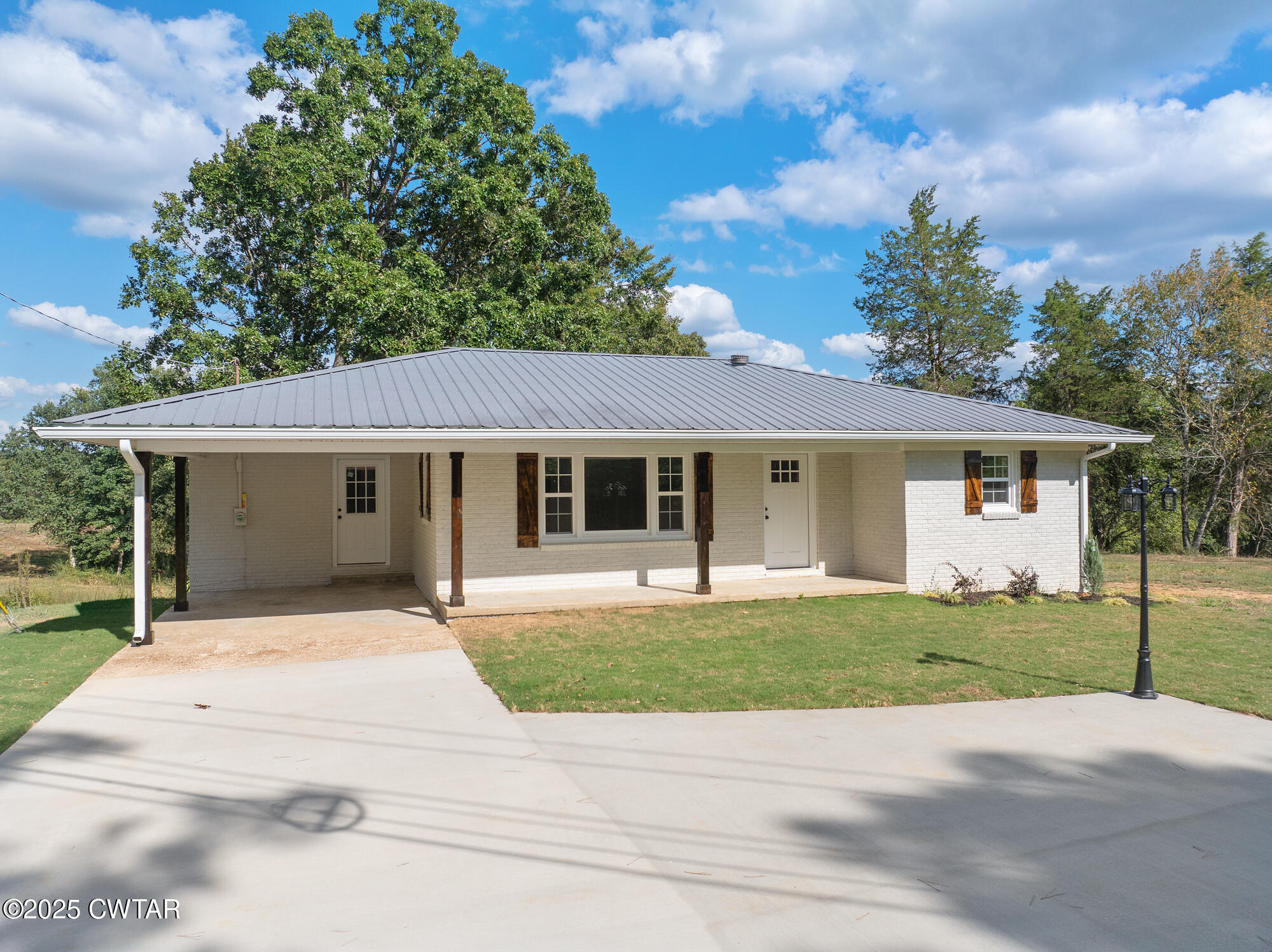 7371 Brooksie Thompson Road Bath Springs, TN 38311 - Photo 4 of 25 front view of a house with a yard