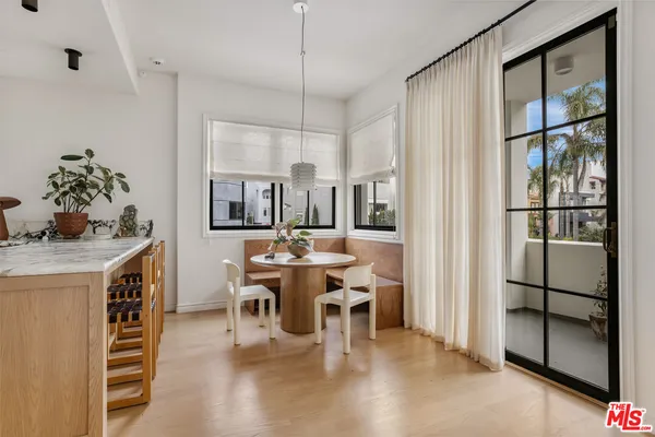 a kitchen with stainless steel appliances granite countertop a kitchen island a stove and a sink