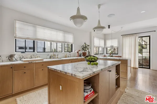 a bedroom with two beds and a window