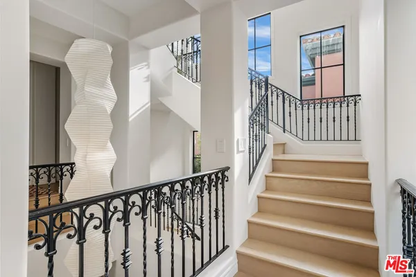 a bathroom with a granite countertop sink vanity and mirror
