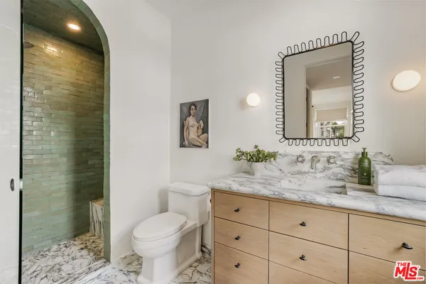 a bed room with a bed and a fireplace