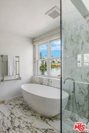 a bathroom with a toilet sink vanity and mirror