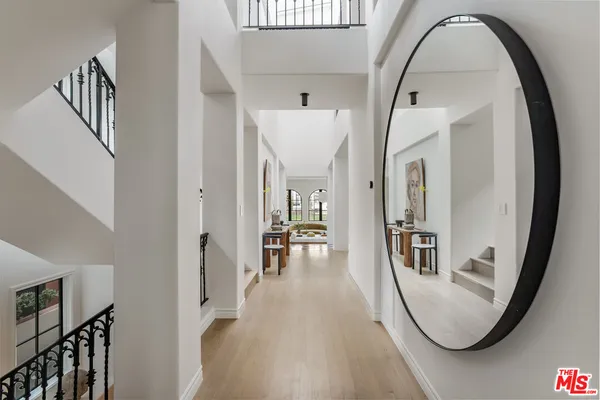 a living room with furniture a rug and a table