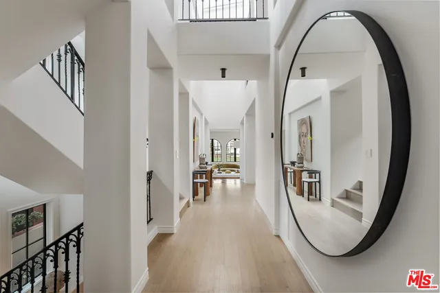 a living room with furniture a rug and a table