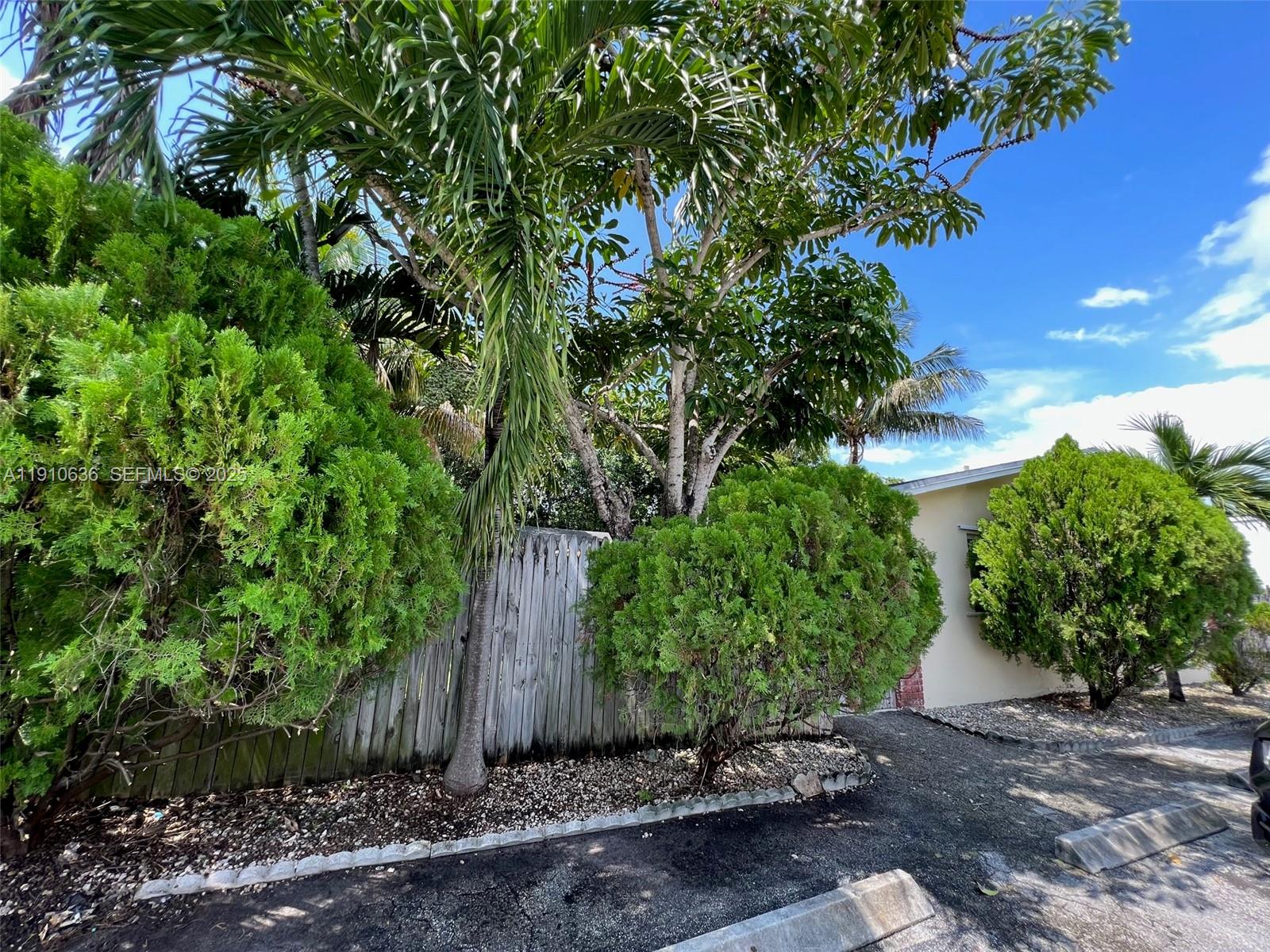 4841 Southwest 45th Avenue, Unit 3 Hollywood, FL 33314 - Photo 1 of 6 a view of a garden with plants