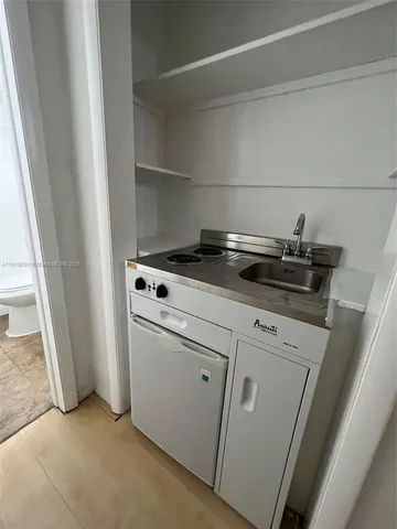 a view of a kitchen with appliances