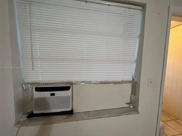 a view of a door and chair in the balcony