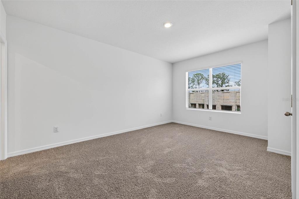 31264 Paper Birch Street Wesley Chapel, FL 33545 - Photo 17 of 32 an empty room with a window