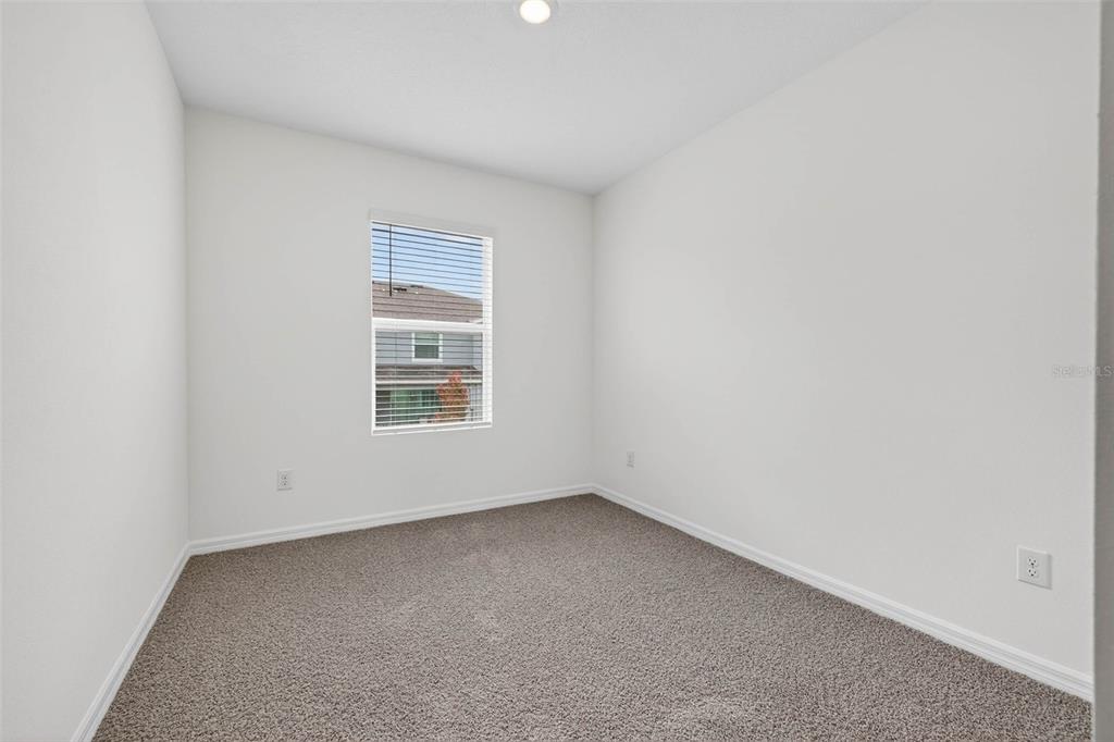 31264 Paper Birch Street Wesley Chapel, FL 33545 - Photo 24 of 32 an empty room with a window