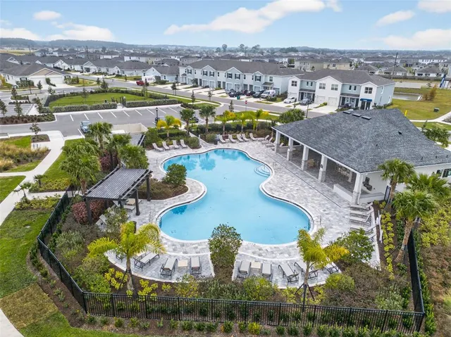 a view of a house with outdoor space and ocean view