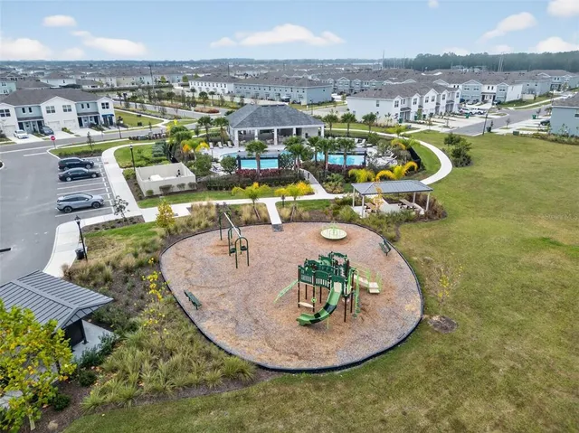 a view of a swimming pool with a chairs and couches
