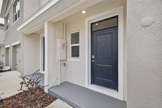 a view of a livingroom with wooden floor and a cabinet